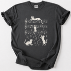 Playful cats dance across the staff lines in this whimsical music-lover's tee. Soft, premium cotton for everyday comfort.