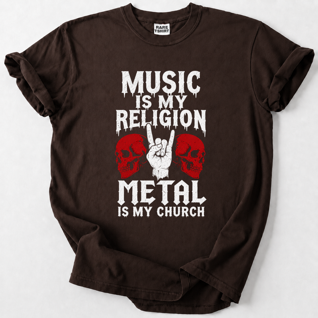 A dark brown short-sleeve t-shirt with a graphic print that reads 'MUSIC IS MY RELIGION METAL IS MY CHURCH' in white distressed lettering, flanked by two red skulls and a hand making the metal sign.