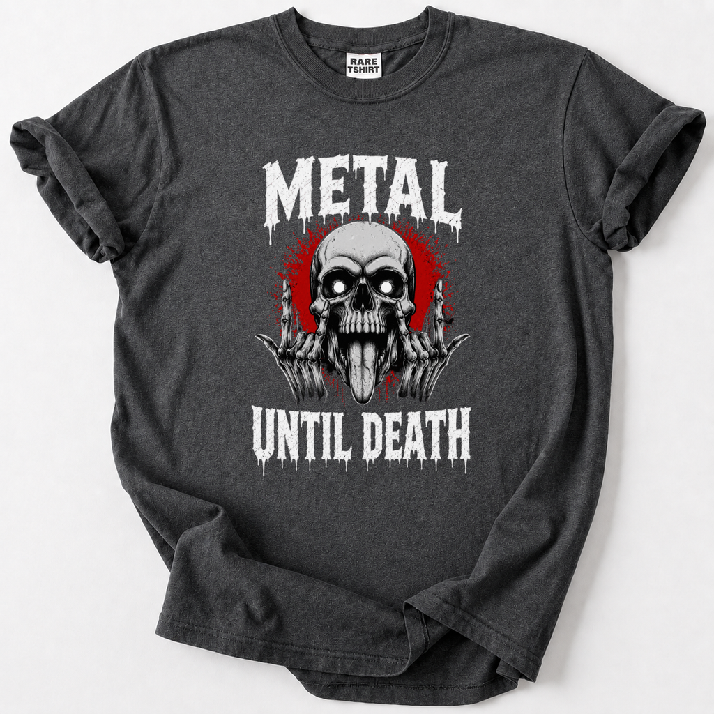 A dark gray heather t-shirt with a graphic print featuring a skull, red splatter, and the text 'METAL UNTIL DEATH' in a dripping white font. The shirt is laid flat on a light gray background, with a 'RARELY SEEN' brand label visible inside the collar.