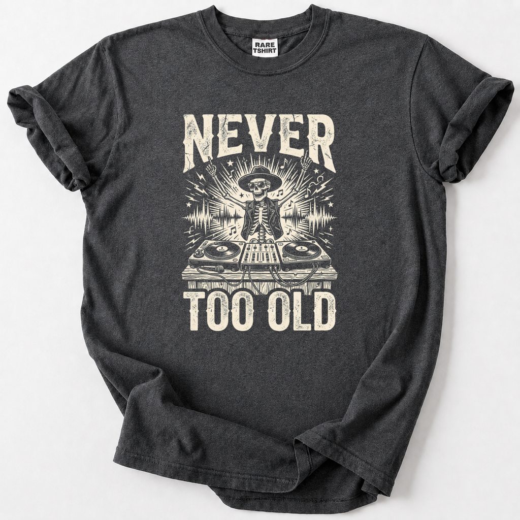 Rock the decks at any age with our Never Too Old DJ Skeleton Tee. Premium soft cotton, bold vintage graphic 
