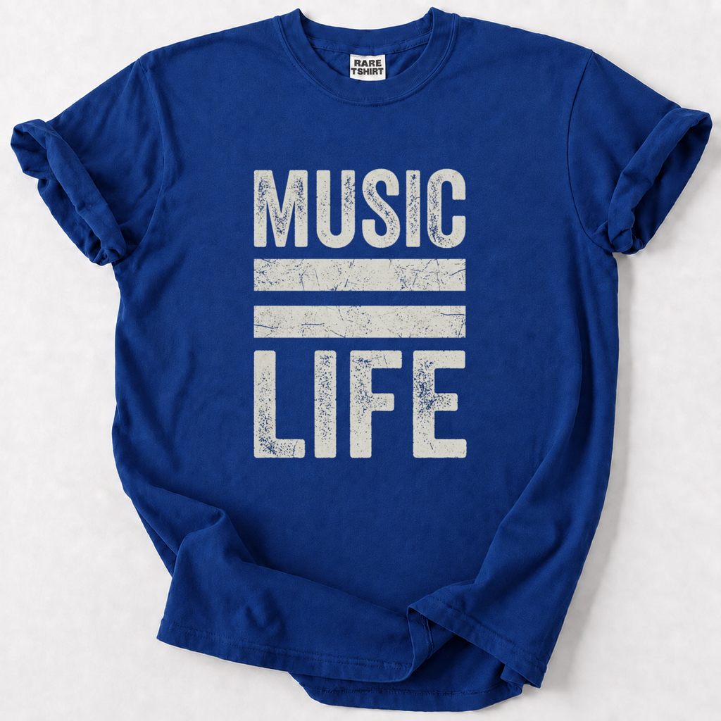 A royal blue short-sleeve t-shirt with a distressed white graphic reading 'MUSIC LIFE' separated by two horizontal stripes, laid flat on a light gray background. The inner neck label shows the brand 'RARELY TIED'.