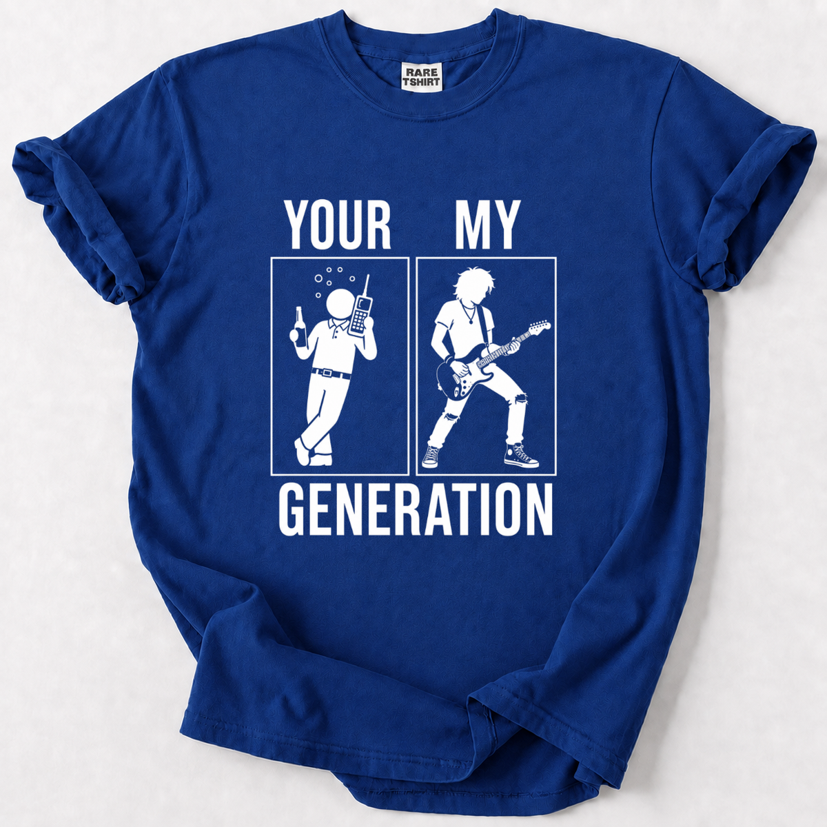 A royal blue short-sleeve t-shirt with a white graphic print that reads 'YOUR MY GENERATION' and shows two white stick figures in separate boxes, one holding a beer and one holding a guitar. The shirt is laid flat on a light gray background.