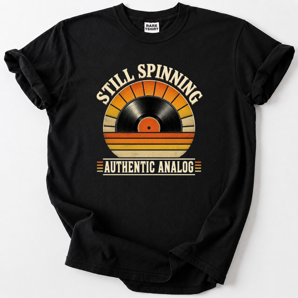 Retro vinyl record t-shirt with "Still Spinning, Authentic Analog" design, black tee