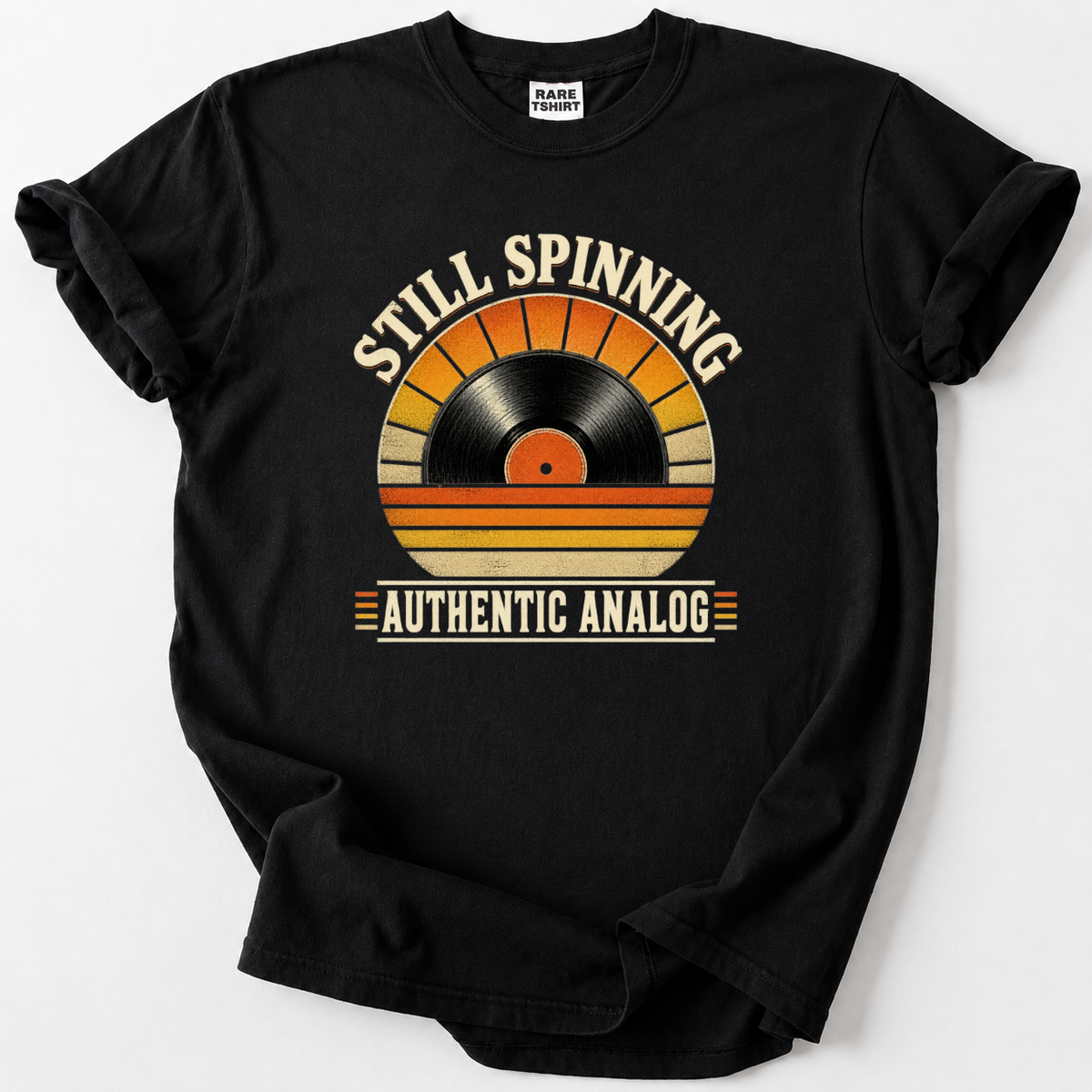 Retro vinyl record t-shirt with "Still Spinning, Authentic Analog" design, black tee
