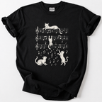 Playful cats dance across the staff lines in this whimsical music-lover's tee. Soft, premium cotton for everyday comfort.
