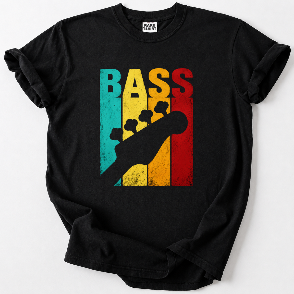 A black short-sleeve t-shirt with a colorful graphic on the front featuring the word 'BASS' in vertical stripes of teal, yellow, orange, and red, overlaid with a black bass guitar silhouette. The shirt is laid flat on a light gray background.