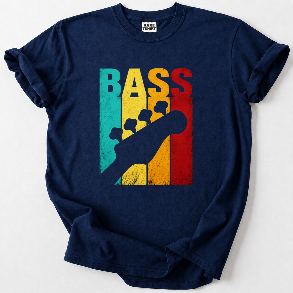A navy blue short-sleeve t-shirt with a colorful graphic on the front. The graphic features the word 'BASS' in vertical retro stripes of teal, yellow, gold, and red, overlaid with a black silhouette of a bass guitar headstock.