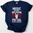 A navy blue short-sleeve t-shirt with a graphic print that reads 'MUSIC IS MY RELIGION METAL IS MY CHURCH' in white distressed lettering, featuring two red skulls and a hand making the rock on gesture in the center. The shirt is laid flat on a light gray background.