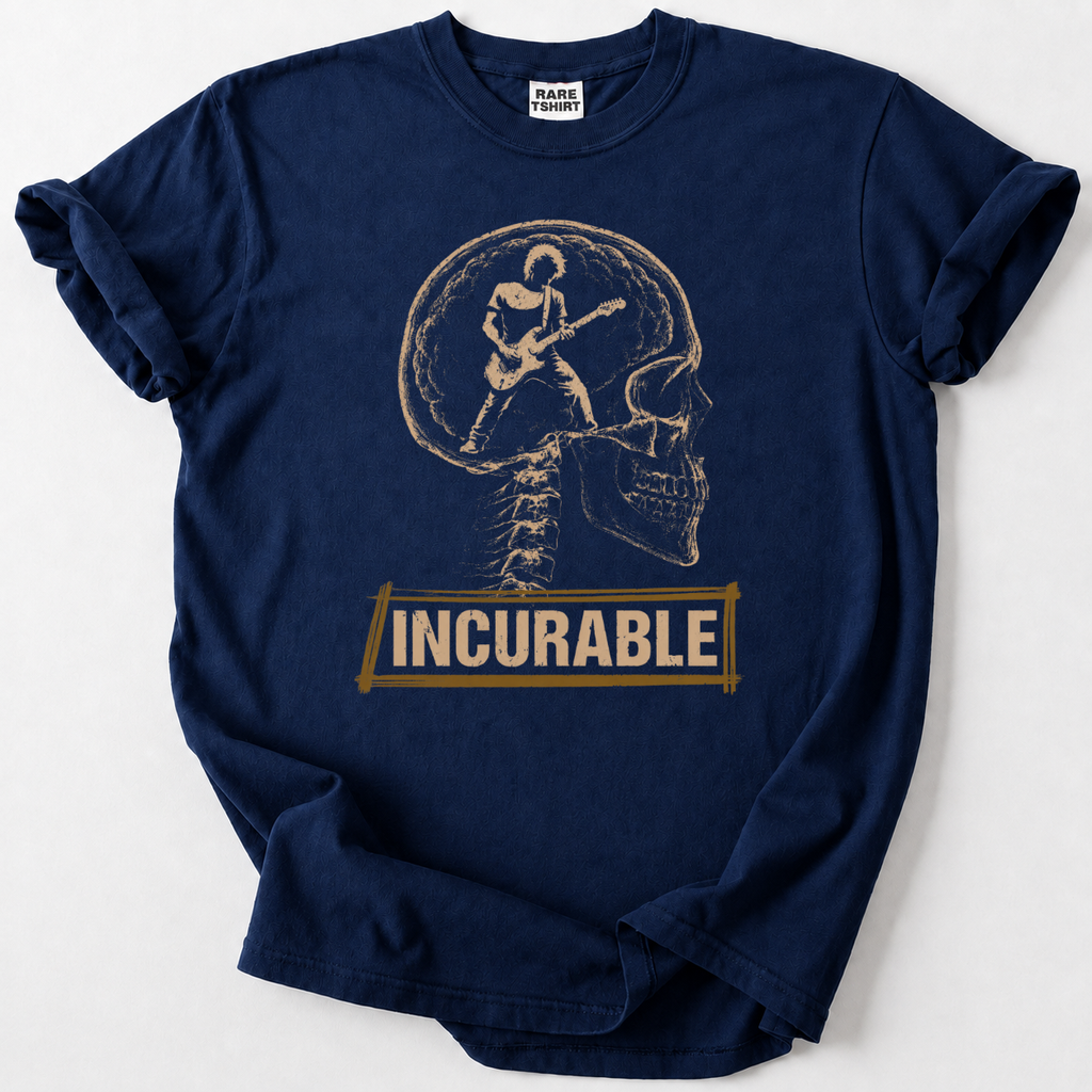 A navy blue t-shirt with a graphic print of a skull and spine featuring a guitarist inside, with the word 'INCURABLE' printed below in a gold banner. The shirt is laid flat on a light gray background.