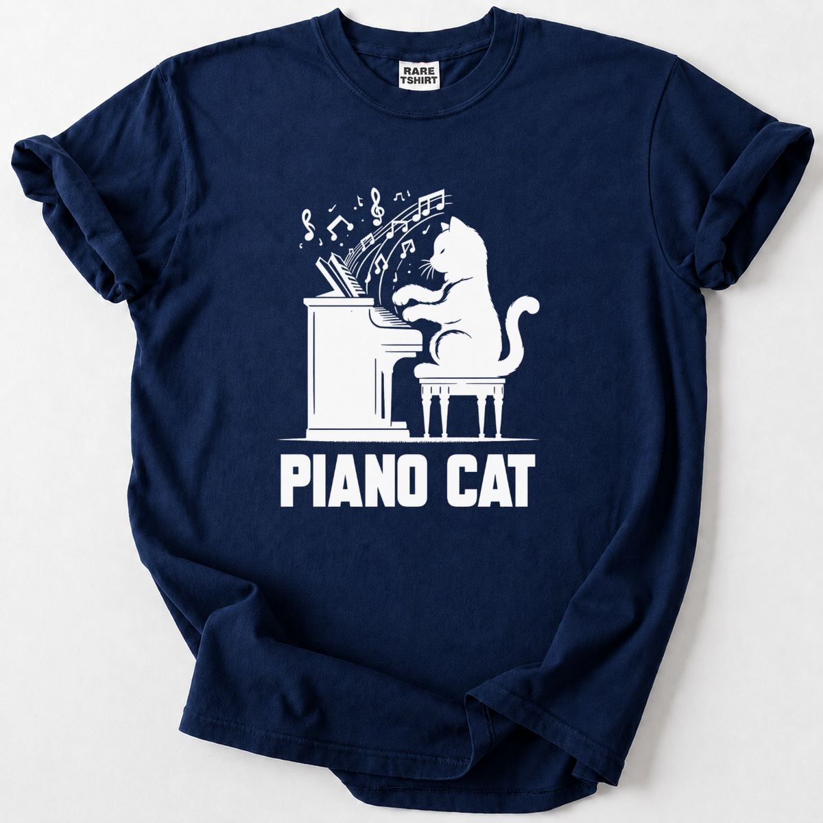 Rock a playful Piano Cat design on soft, premium cotton. The perfect gift for cat lovers, pianists &amp; music fans